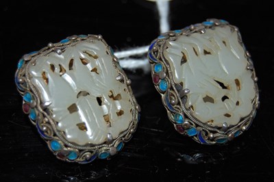Lot 56 - A pair of Chinese pale celadon jade and white...
