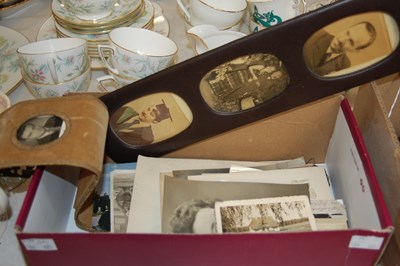 Lot 582 - A box containing assorted vintage photographs.