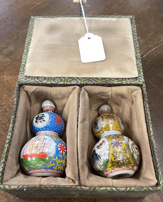 Lot 583 - A pair of Chinese opaque glass double gourd...