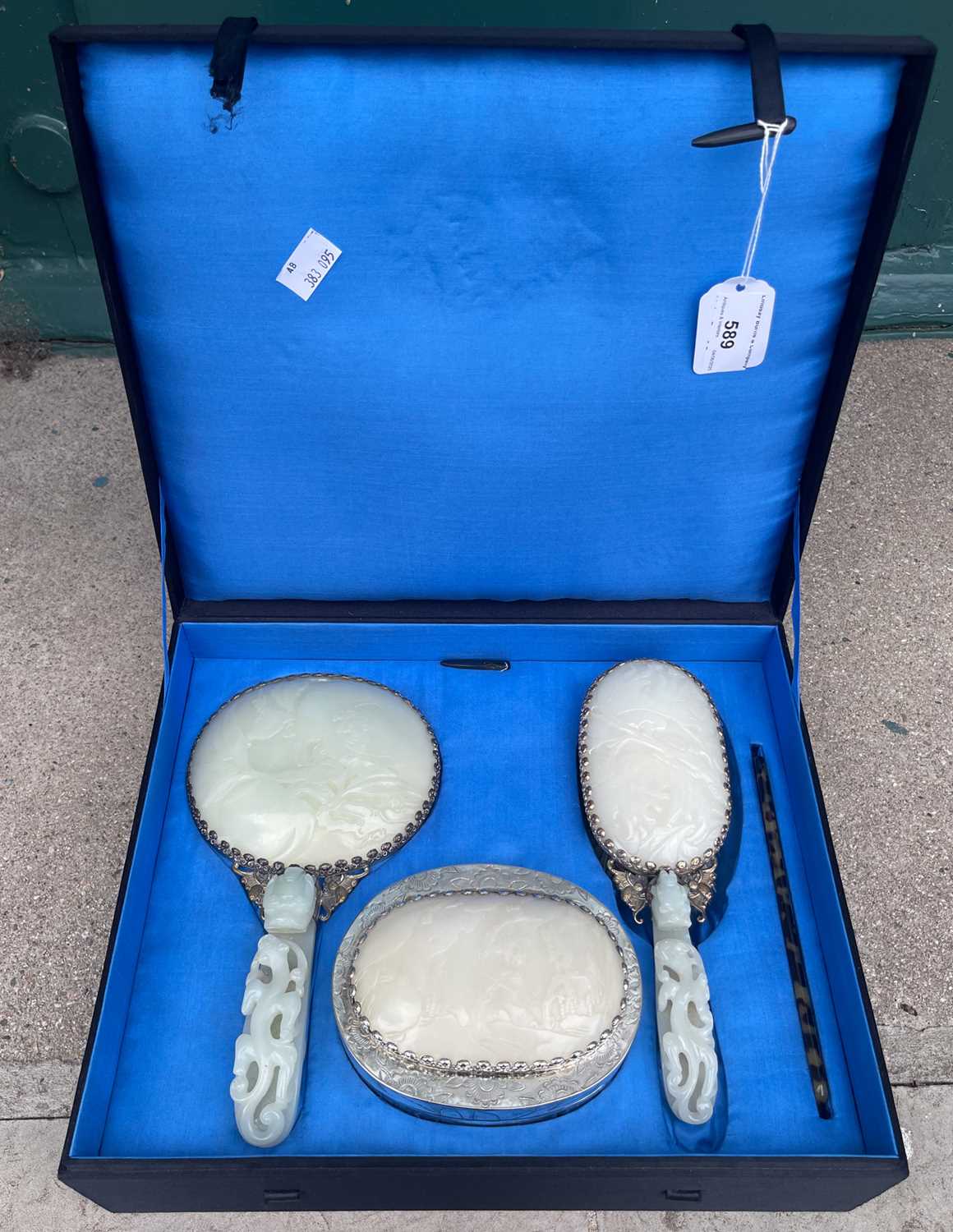 Lot 589 - A Chinese jade and white metal mounted three...