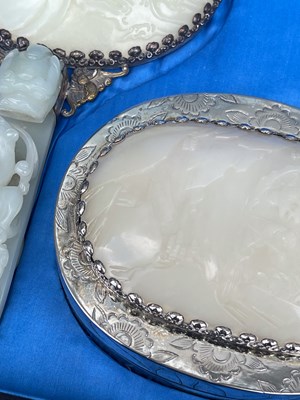 Lot 589 - A Chinese jade and white metal mounted three...