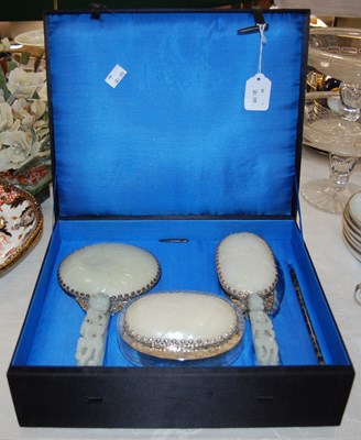 Lot 589 - A Chinese jade and white metal mounted three...