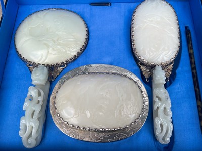Lot 589 - A Chinese jade and white metal mounted three...