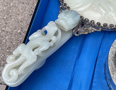 Lot 589 - A Chinese jade and white metal mounted three...