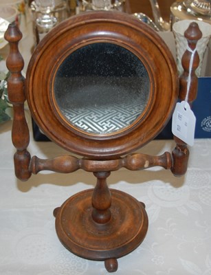 Lot 620 - A Treen table mirror with hinged circular...