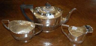 Lot 504 - A three piece EP tea set.