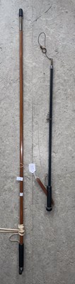 Lot 680 - A rod rest support stick, 134cm long; and a...