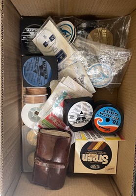 Lot 692 - A box of assorted fishing line; leather fly...