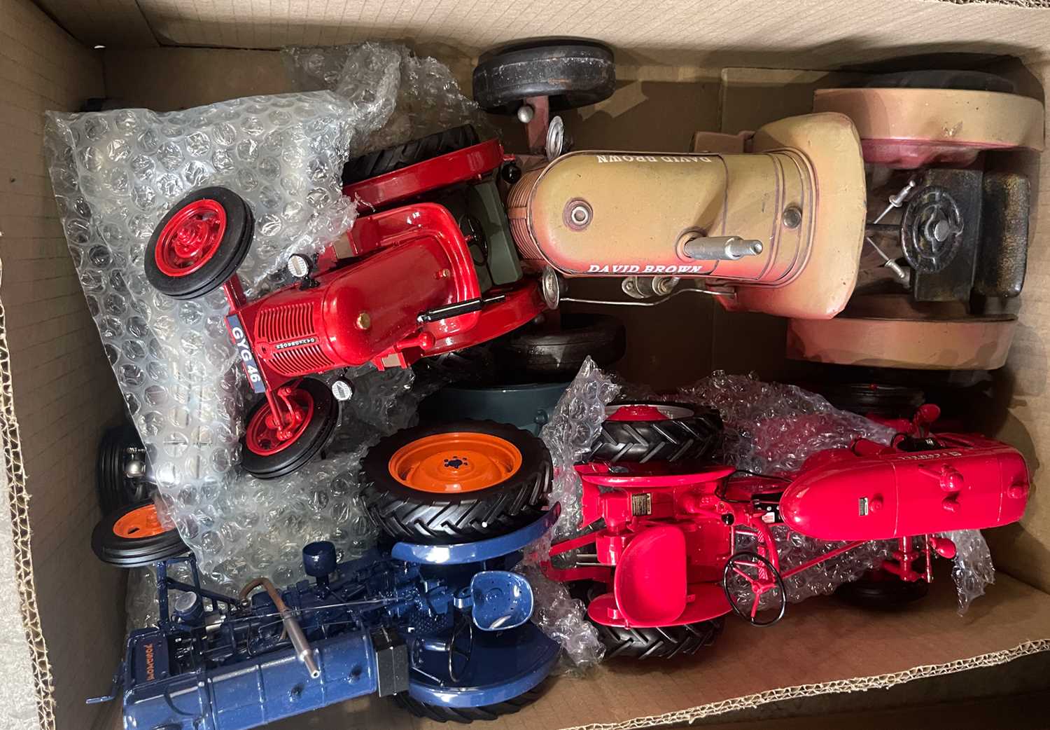 Lot 735 - A box of assorted model tractors, to include