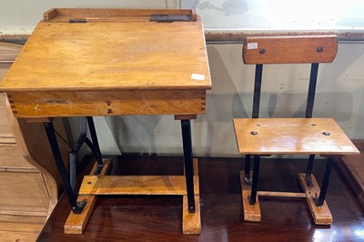 Lot 845 - A child's school desk and corresponding chair,...
