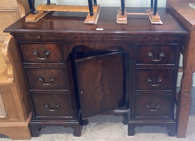 Lot 718 - A reproduction George III style kneehole desk,...