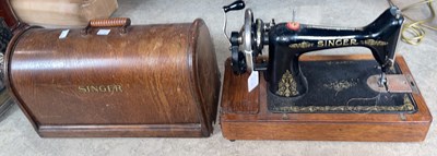 Lot 859 - A vintage Singer sewing machine in original...