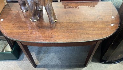 Lot 716 - A 19th century mahogany D-end table, raised on...