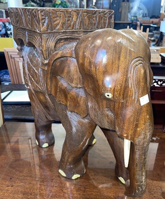 Lot 870 - A decorative carved wood elephant form...