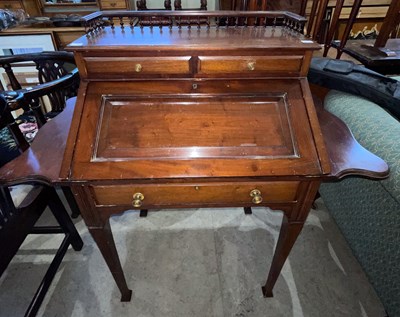 Lot 876 - An oak two tier dumb waiter with revolving...