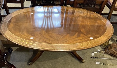 Lot 897 - A reproduction mahogany and brass inlaid oval...