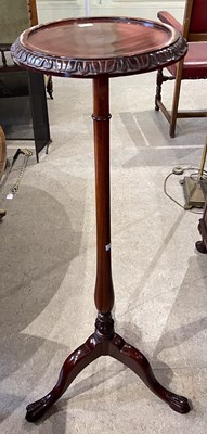 Lot 900 - A mahogany jardiniere stand on three splayed...