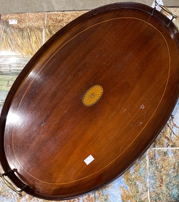 Lot 916 - A mahogany and boxwood lined twin handled oval...