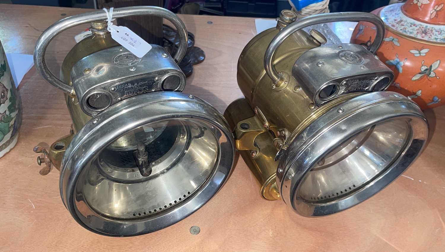 Lot 636 - A pair of white metal and brass Lucas King of...