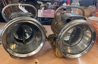 Lot 636 - A pair of white metal and brass Lucas King of...