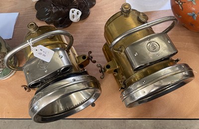 Lot 636 - A pair of white metal and brass Lucas King of...