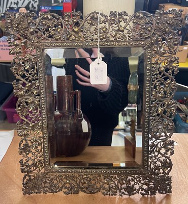 Lot 642 - A Continental white metal table mirror, the...