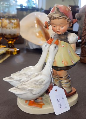 Lot 645 - A Goebel figure group of girl and two geese,...