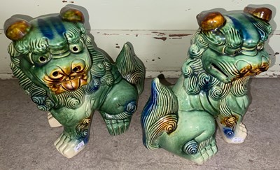 Lot 650 - A pair of green, blue and brown glazed pottery...