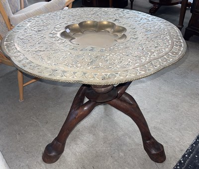 Lot 980 - A Middle Eastern brass top occasional table on...