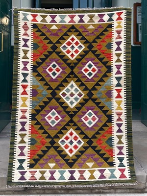 Lot 998 - A Maimana Kilim rug, the ochre coloured ground...