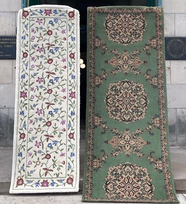 Lot 1001 - A 20th century white ground wool runner,...