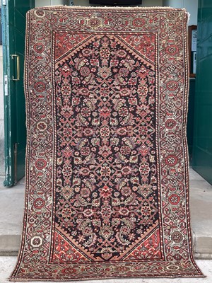 Lot 876 - A Persian rug, late 19th/ early 20th century,...