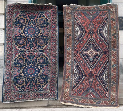 Lot 1012 - Two Persian rugs, one with a madder ground...