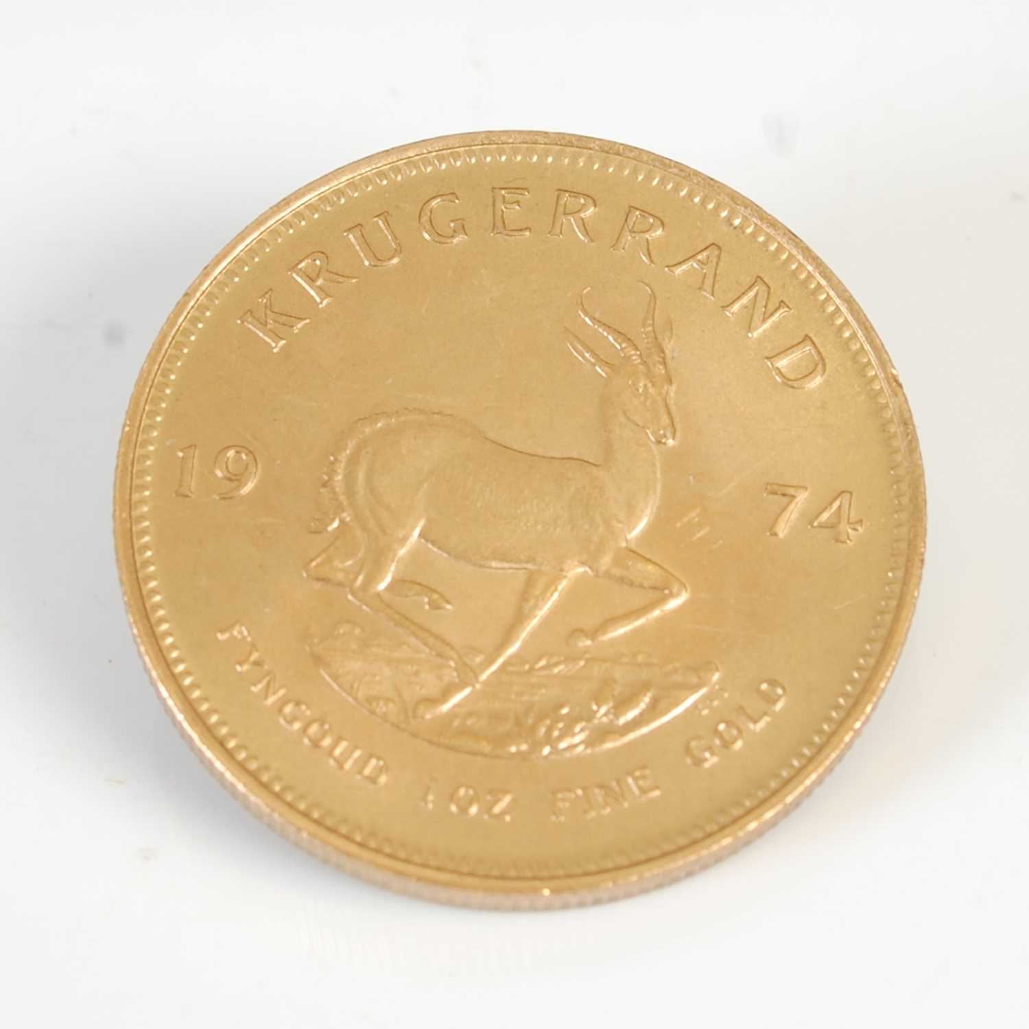 Lot 90 - A South African gold Krugerrand, dated 1974.