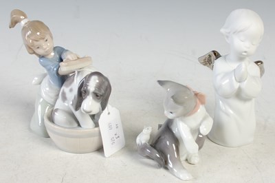 Lot 14 - A group of three Lladro porcelain figures to...