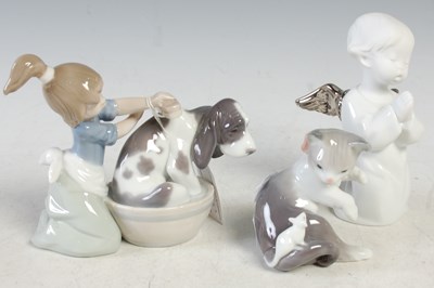 Lot 14 - A group of three Lladro porcelain figures to...