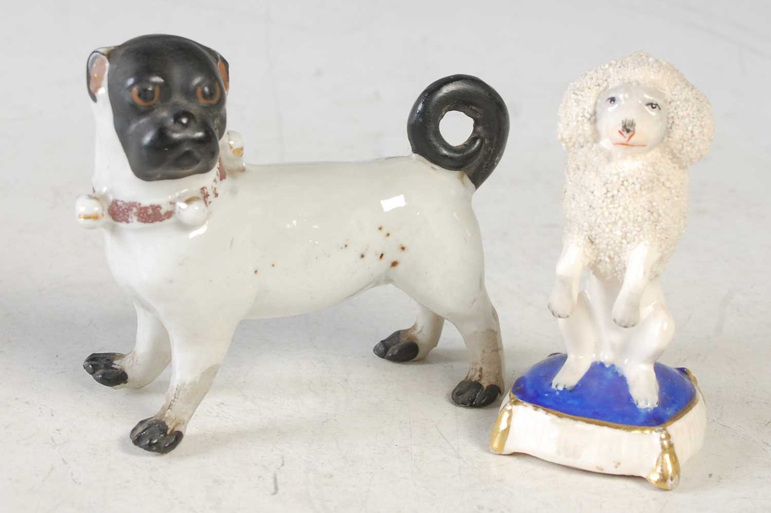 Lot 28 - Two Antique ceramic figures of dogs to include...