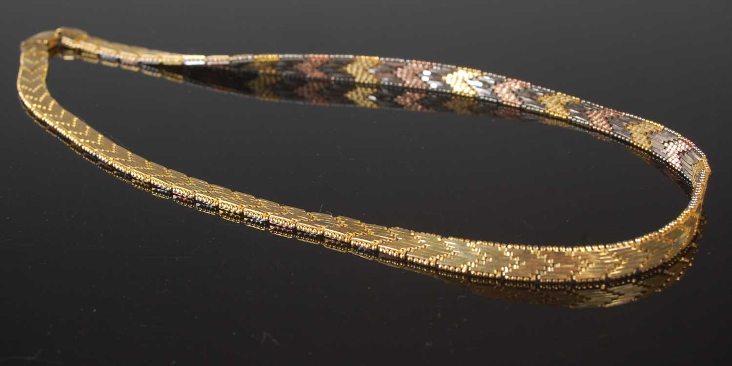 Lot 35 - A silver gilt and three colour necklace,...
