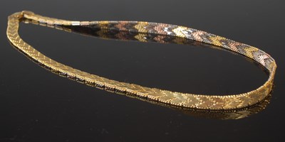 Lot 35 - A silver gilt and three colour necklace,...