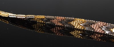 Lot 35 - A silver gilt and three colour necklace,...