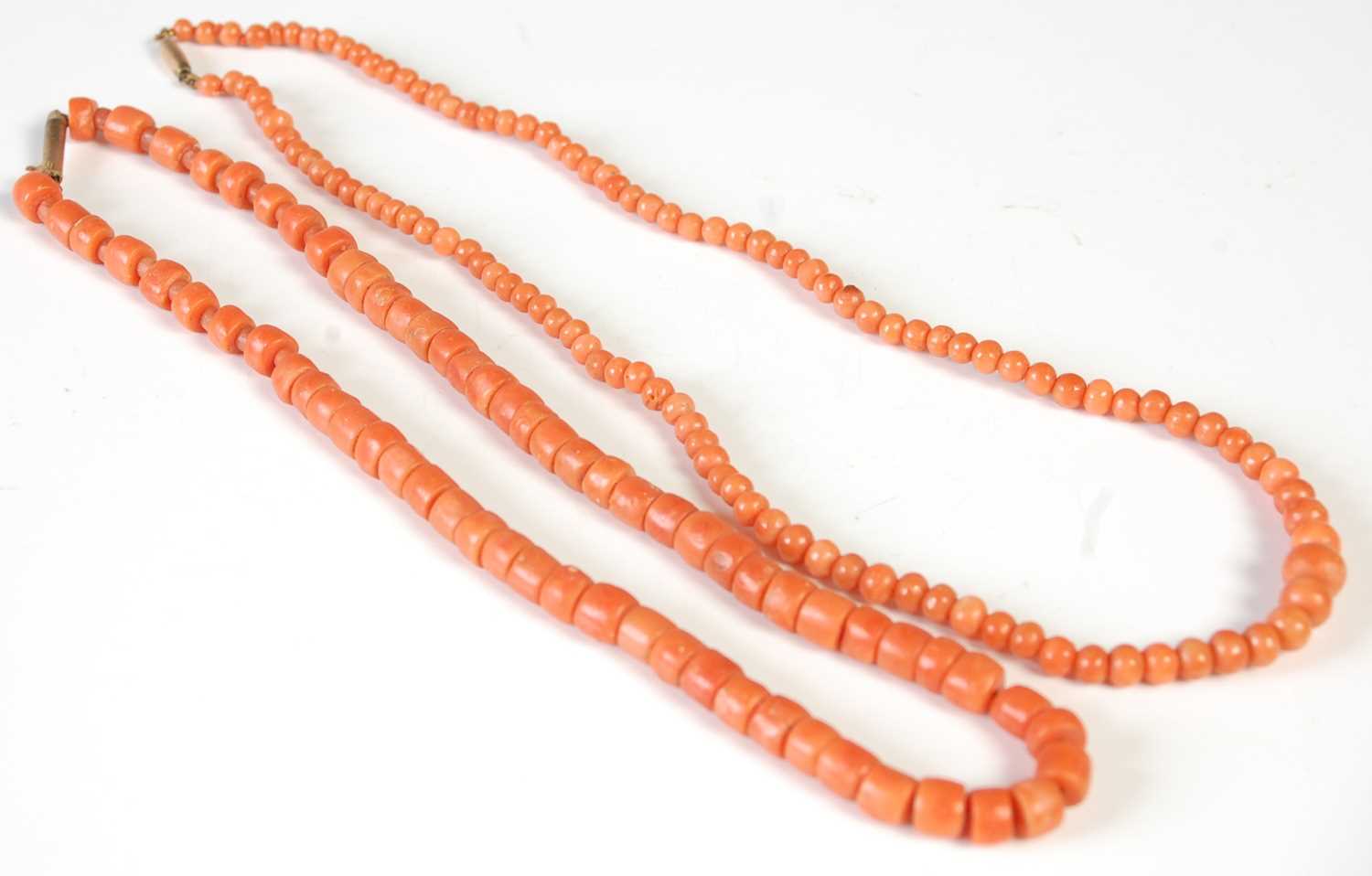 Lot 37 - Two early 20th century red coral necklaces, in...