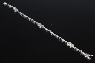 Lot 38 - A white metal and diamond studded bracelet,...