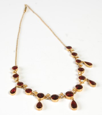 Lot 40 - An Edwardian yellow metal, garnet and seed...