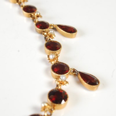 Lot 40 - An Edwardian yellow metal, garnet and seed...