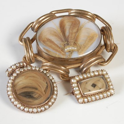 Lot 45 - A group of three yellow metal mourning...