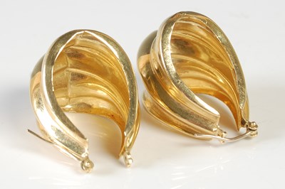 Lot 52 - A pair of yellow metal earrings, stamped '750',...