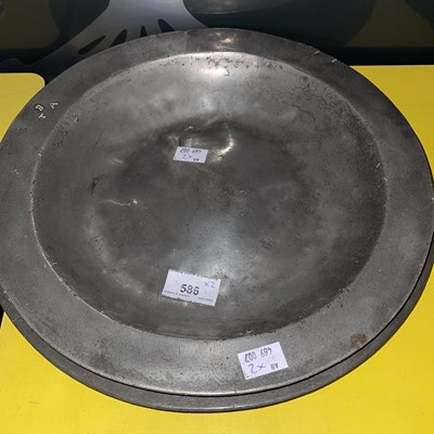 Lot 586 - An 18th century pewter charger with plain...