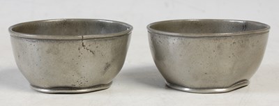 Lot 115 - A pair of 18th century pewter circular salt...