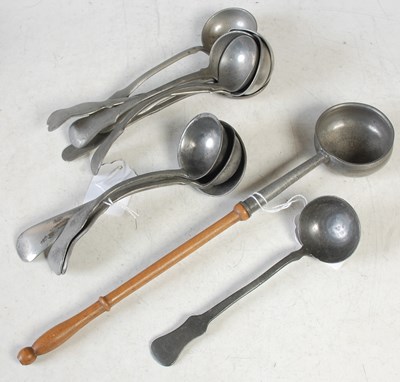 Lot 348 - A collection of ten pewter toddy ladles...