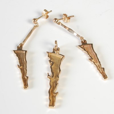 Lot 58 - A yellow metal pendant stylised in the form of...